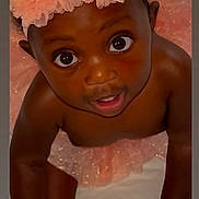 Kinzey is registered to the contest to win money with this photo: baby, child, infant, headband, tutu, peach, pink, crawling, cute, wide_eyes, curious, soft, white_background, wearing, face, hands, legs, indoor, portrait, person