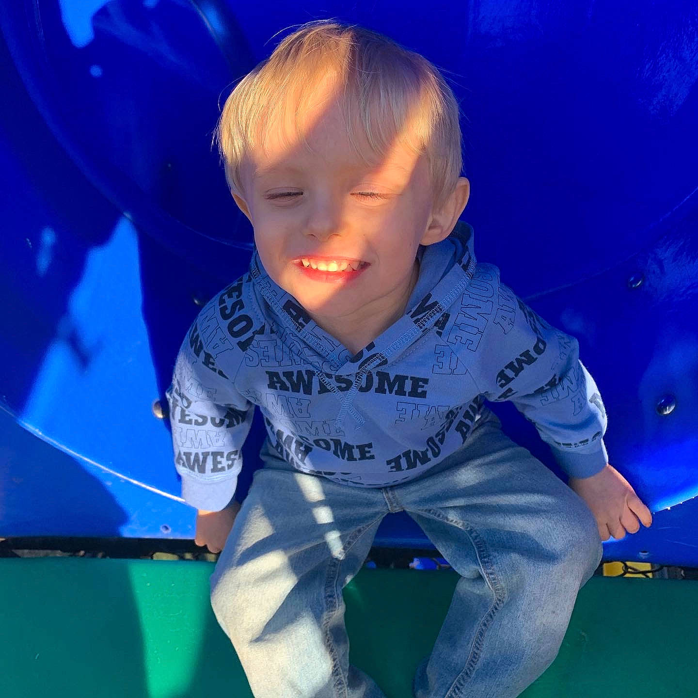 Carter joined the competition — help win amazing prizes! azure, baby, baby_toddler_clothing, blue, child, elbow, electric_blue, flooring, fun, grass, happy, joy, knee, leisure, person, personal_protective_equipment, recreation, sky, sleeve, sportswear