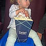 Annie joined the competition — help win amazing prizes! toddler, child, popcorn, snack, blue_seat, pigtails, white_shoes, leggings, white_top, indoor, theater, seat, food, side_view, curious_expression, young_child, casual_clothing, child_eating, person, portrait