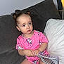 Annie joined the competition — help win amazing prizes! toddler, child, pink_clothing, unicorn_pattern, hairbrush, double_buns, blue_eyes, couch, pillow, indoor, sitting, cute, expression, hair_accessory, furniture, person, portrait, young_child, home, casual