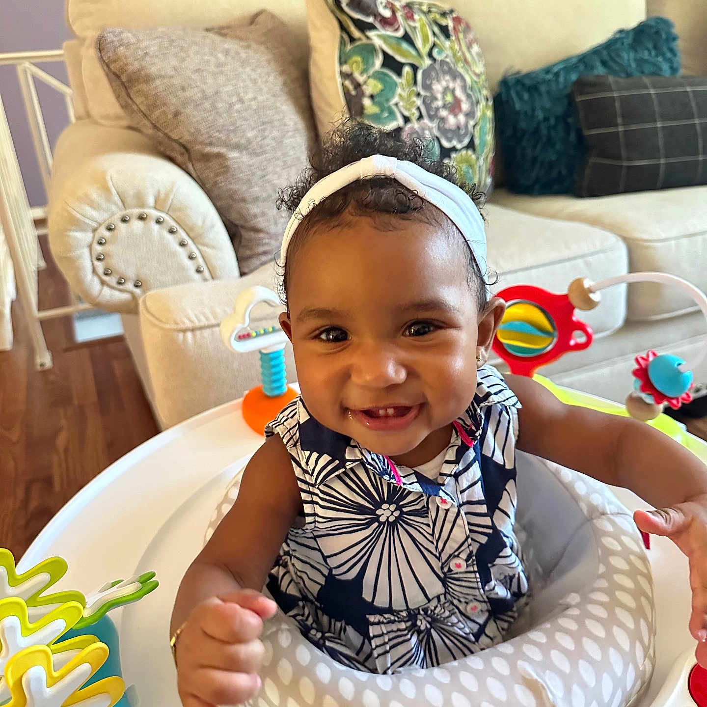 Lilliana joined the competition — help win amazing prizes! architecture, baby, babylaughing, building, couch, cushion, cutlery, face, furniture, happy, head, homedecor, indoors, livingroom, person, photography, portrait, sitting, smile, spoon