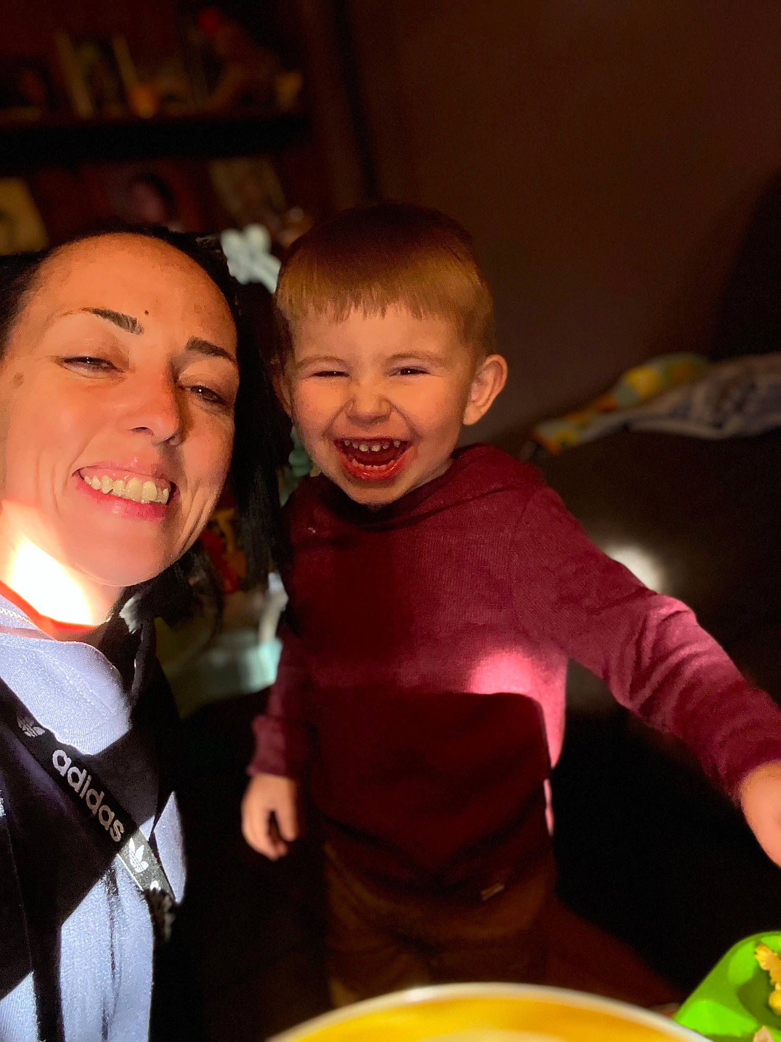 Kato is registered to the contest to win money with this photo: child, event, face, facial_expression, flash_photography, formal_wear, fun, gesture, hairstyle, happy, jewellery, joy, laugh, night, party, person, plate, sitting, smile, t_shirt