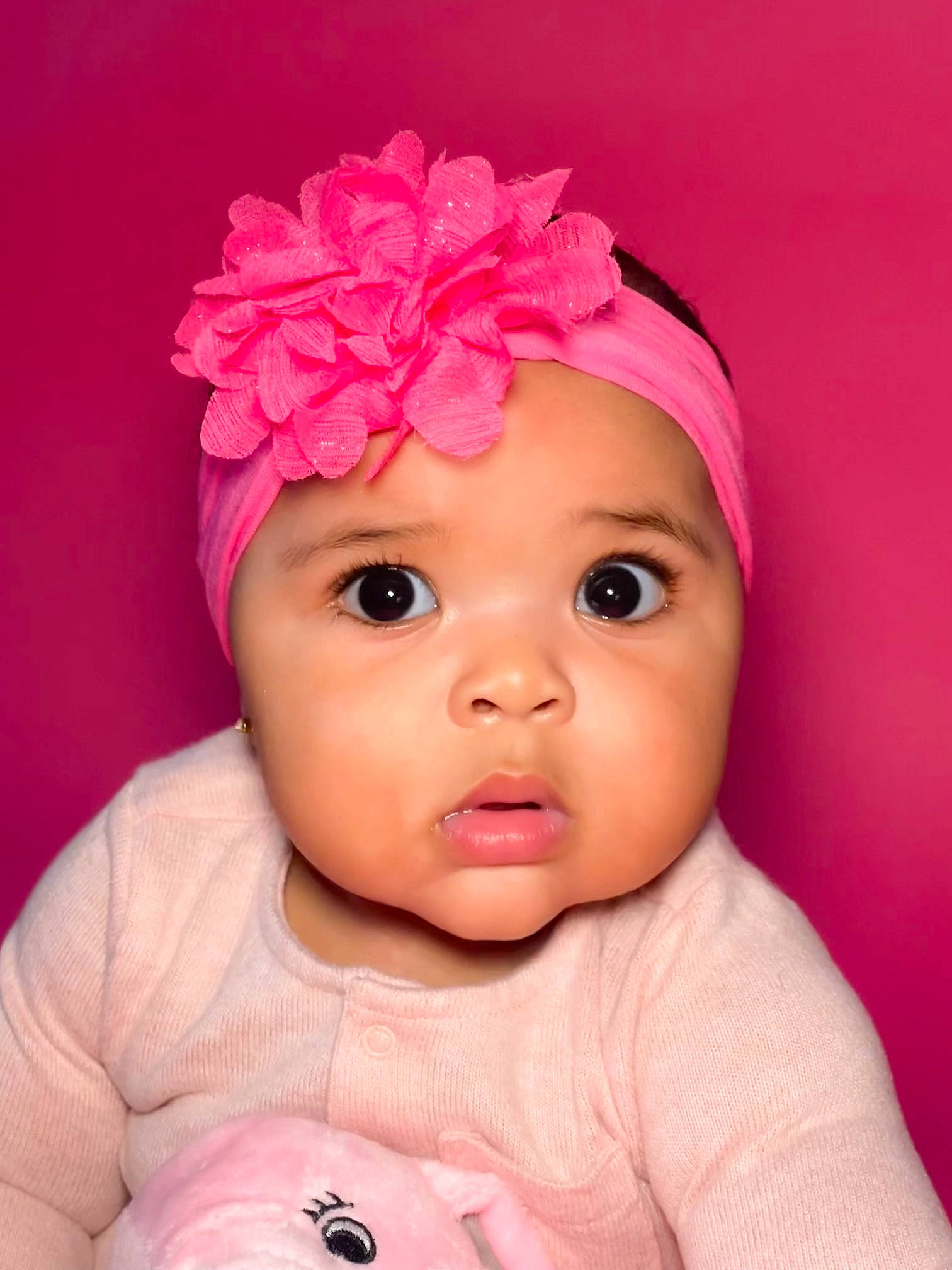 Alexa is registered to the contest to win money with this photo: baby_toddler_clothing, cap, cheek, chin, dress, eye, eyebrow, eyelash, flower, hair, hand, happy, head, headwear, lip, mouth, nose, person, petal, pink