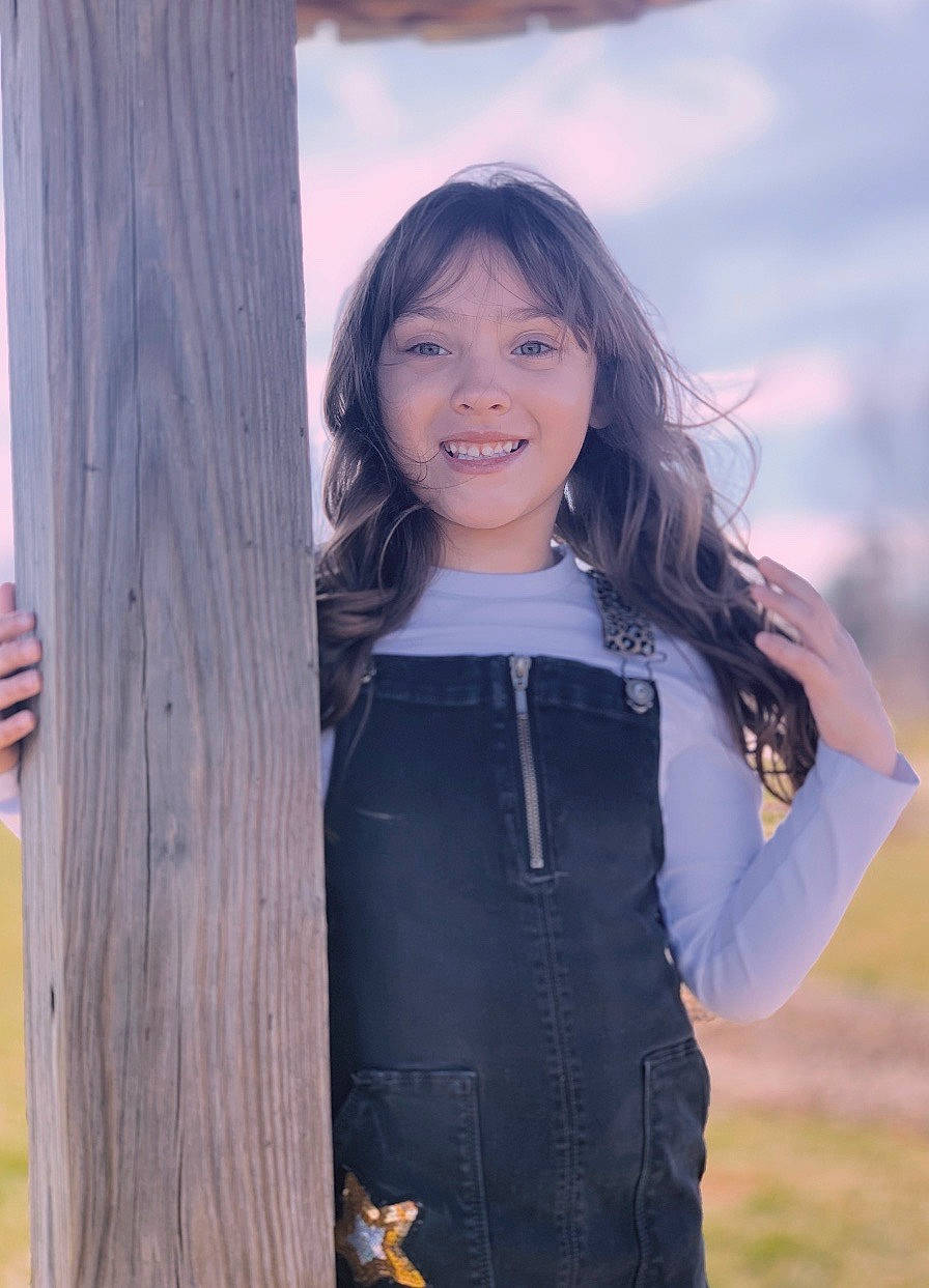 Daniella joined the competition — help win amazing prizes! beauty, black_hair, brown_hair, denim, hair, jeans, joy, long_hair, person, photo_shoot, photography, portrait_photography, smile, standing, tree