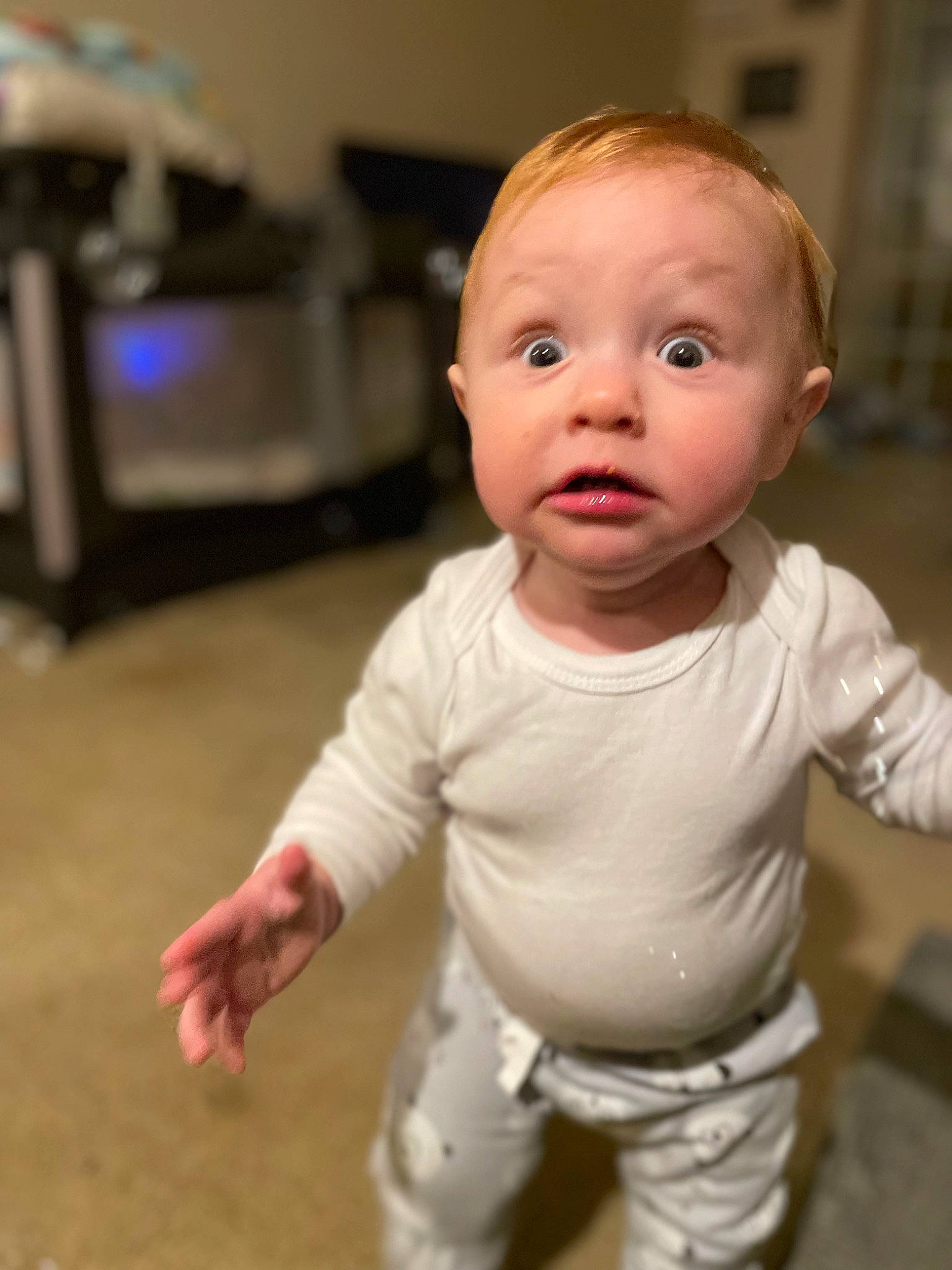 Axel is registered to the contest to win money with this photo: baby, baby_toddler_clothing, cheek, child, comfort, finger, floor, flooring, gesture, happy, iris, lip, mammal, nose, person, skin, sleeve, standing, surprise, thumb