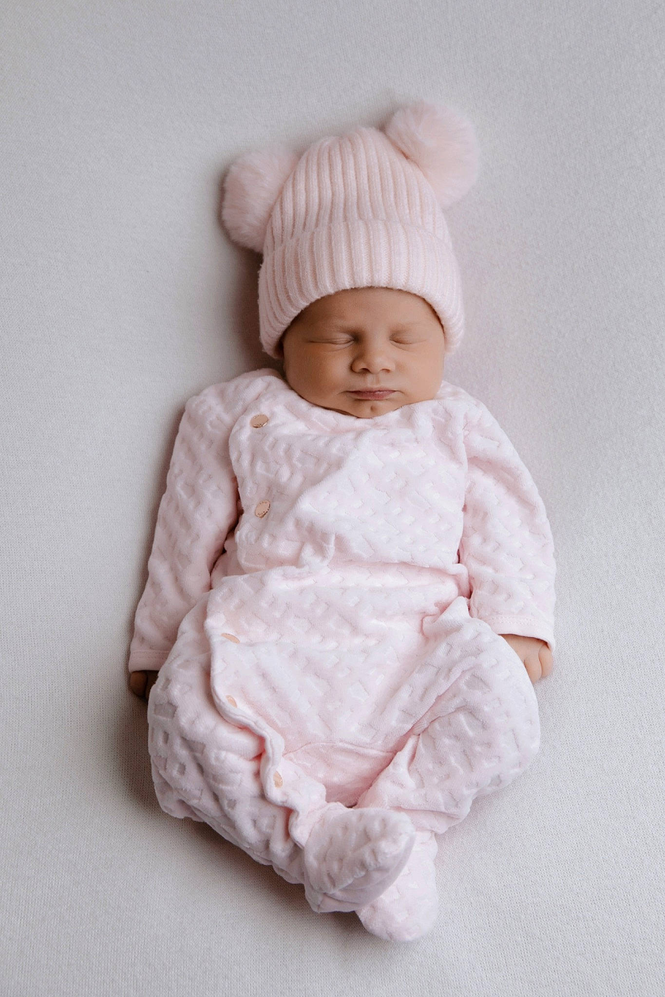 Hailey participe au concours pour gagner de l'argent avec cette photo : baby, baby_toddler_clothing, beanie, cap, cheek, clothing, collar, comfort, face, headgear, headwear, knit_cap, linens, magenta, outerwear, peach, person, sitting, sleeve, toddler