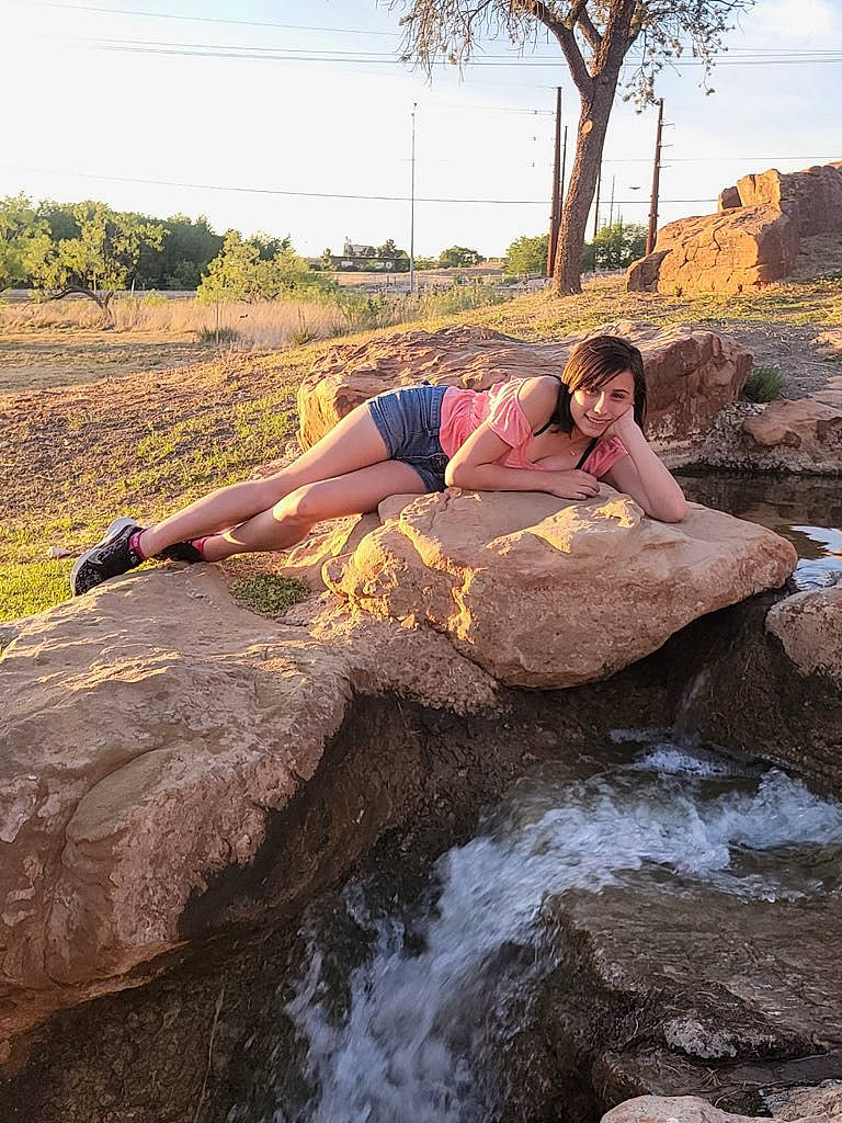 Madisyn joined the competition — help win amazing prizes! bedrock, creek, formation, fun, geology, grass, hill, joy, landscape, leg, leisure, outcrop, people_in_nature, person, plant, recreation, shorts, sky, stream, tree