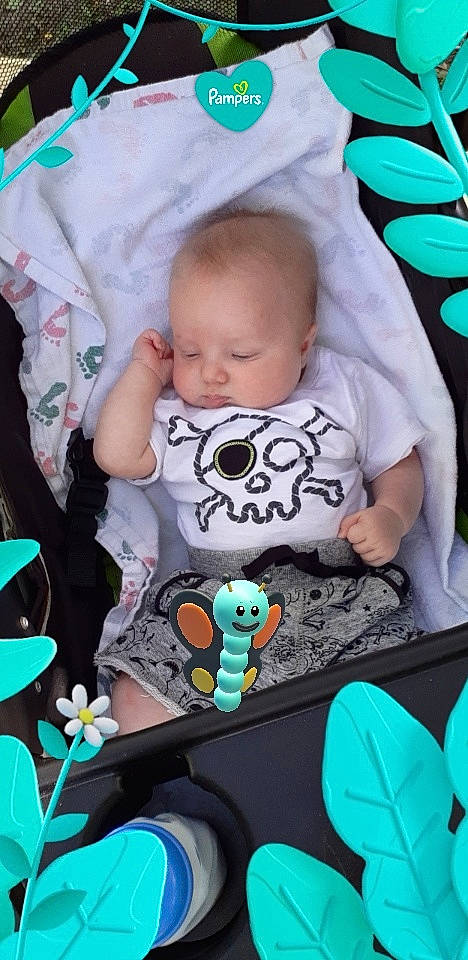 Dominik joined the competition — help win amazing prizes! baby, baby_toddler_clothing, black, blue, cheek, facial_expression, grass, green, hairstyle, head, human, leaf, mammal, organ, person, product, skin, sleeve, textile, vertebrate