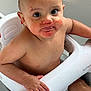 baby, child, bath, water, seat, skin, hand, face, eyes, mouth, messy, red_stains, curious, sitting, indoor, person, young, cute, expression, wet