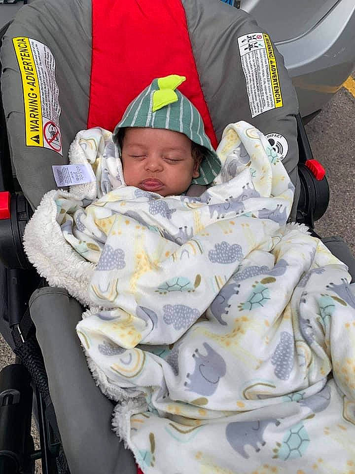 Theodore is registered to the contest to win money with this photo: automotive_tire, baby, baby_carriage, baby_products, baby_safety, baby_sleeping, baby_toddler_clothing, bag, cap, car_seat, child, comfort, event, family_car, hat, headwear, linens, luxury_vehicle, motor_vehicle, person