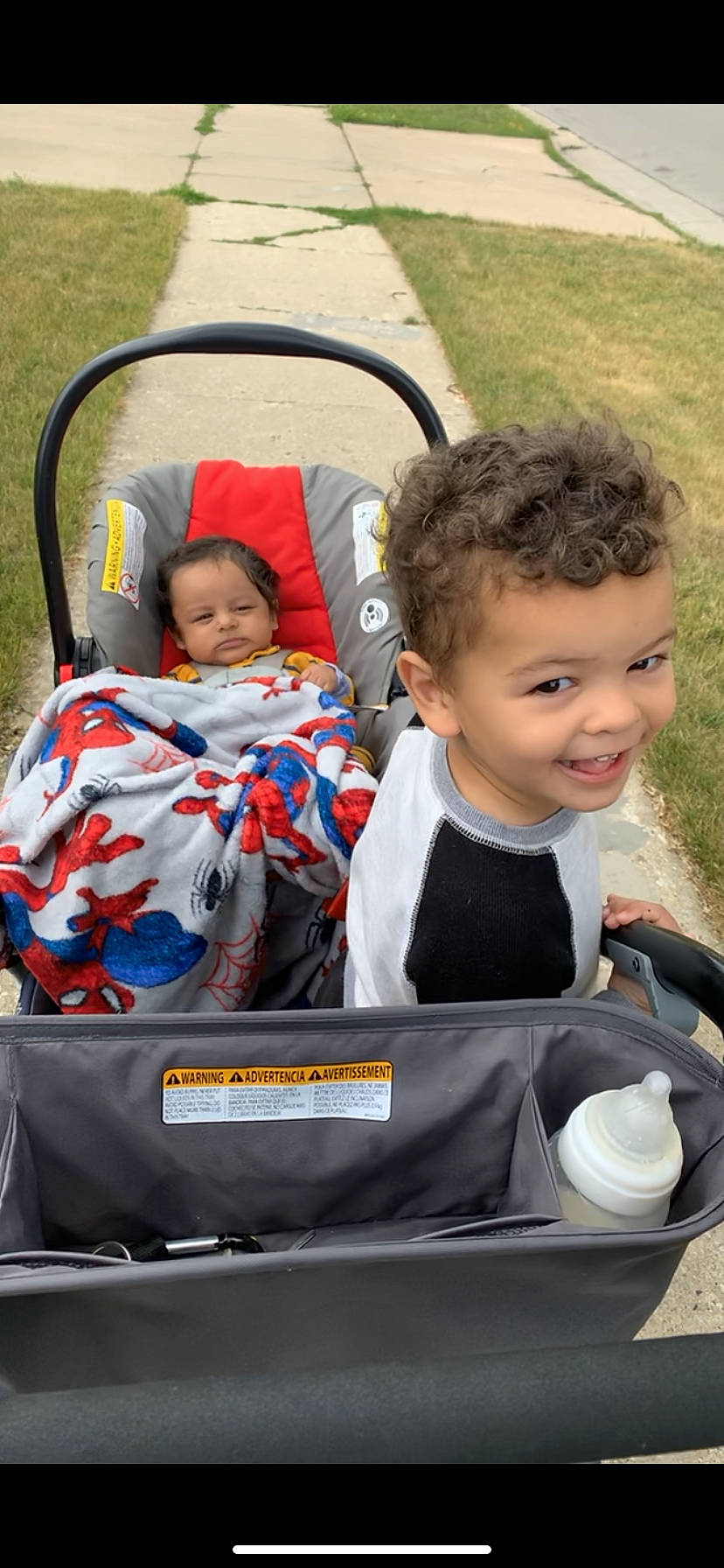 Theodore joined the competition — help win amazing prizes! baby, baby_carriage, baby_products, baby_safety, baby_toddler_clothing, child, comfort, event, facial_expression, fun, grass, happy, joy, leisure, motor_vehicle, person, recreation, sitting, smile, toddler