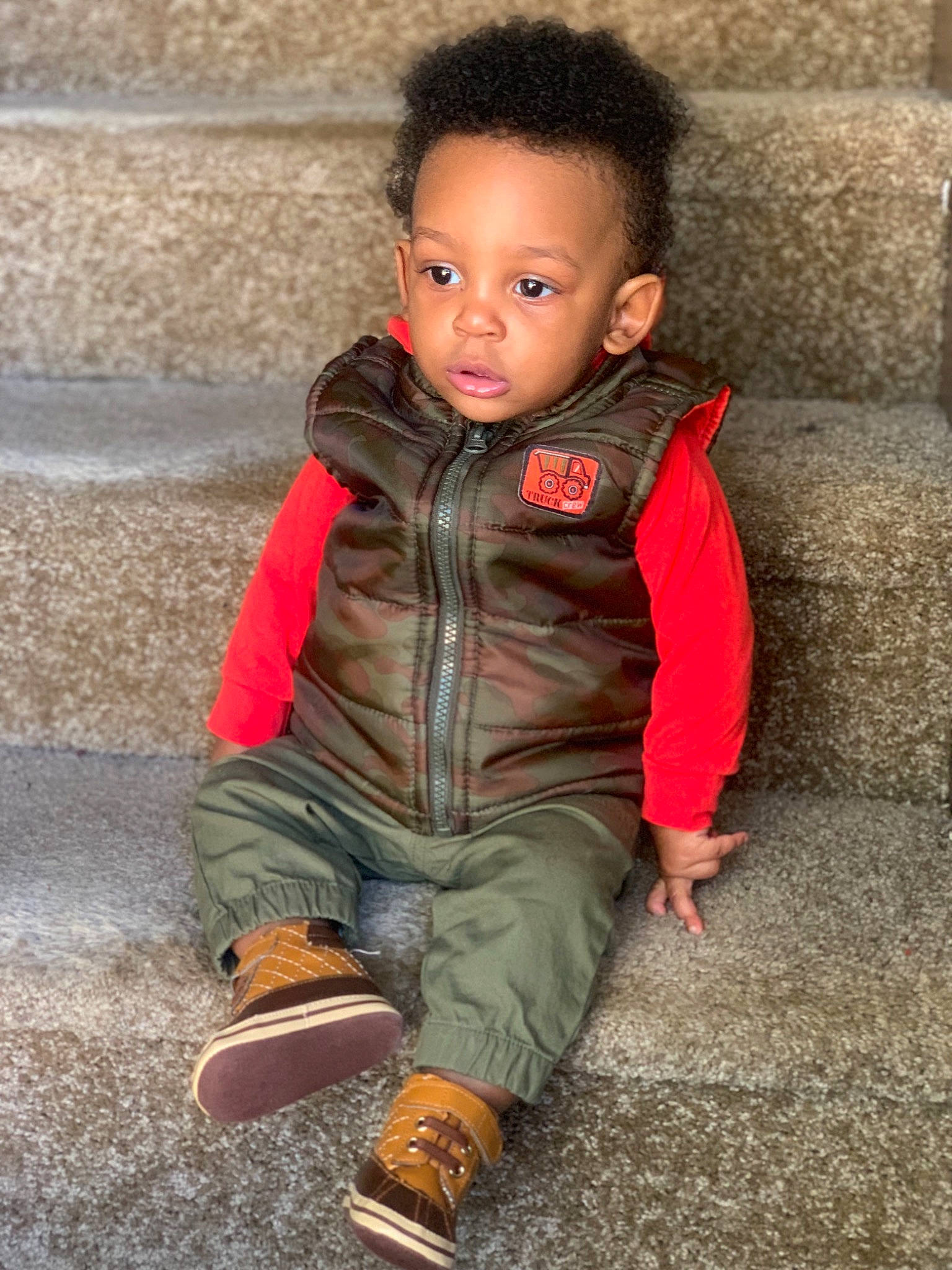 Cree is registered to the contest to win money with this photo: child, child_model, jacket, outerwear, person, skin, sleeve, smile, standing, toddler