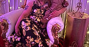 Nyuri joined the competition — help win amazing prizes! blonde_hair, carpet, child, cozy_clothing, decor, elegant, event, fairy_lights, fashion, floral_dress, indoor, metal_stand, people, portrait, purple_lighting, red_roses, seated, throne_chair, toddler, woman