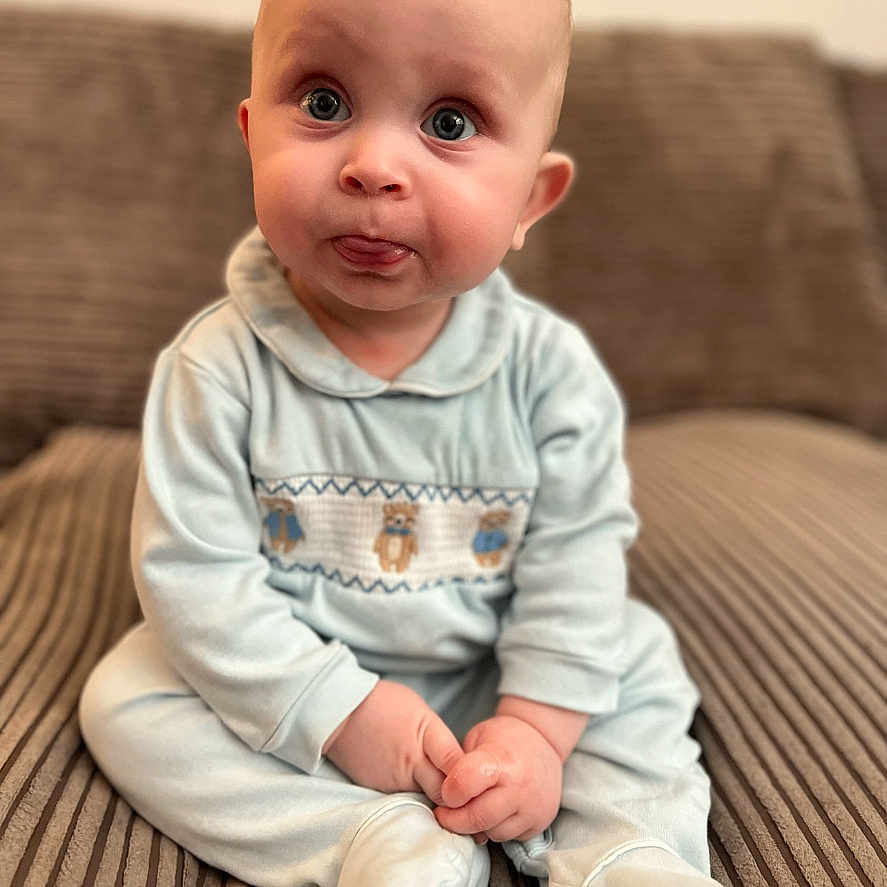 Archie joined the competition — help win amazing prizes! baby, bodypart, clothing, couch, face, finger, furniture, hand, happy, head, hosiery, longsleeve, newborn, pants, person, photography, portrait, sitting, smile, sock