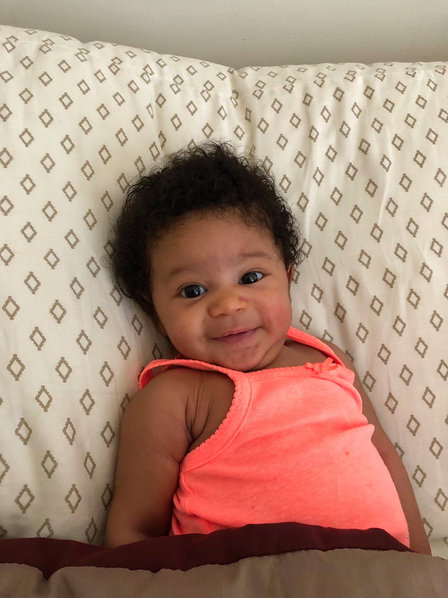 Melani is registered to the contest to win money with this photo: baby, bedding, cheek, child, cushion, furniture, linens, person, pillow, textile, toddler