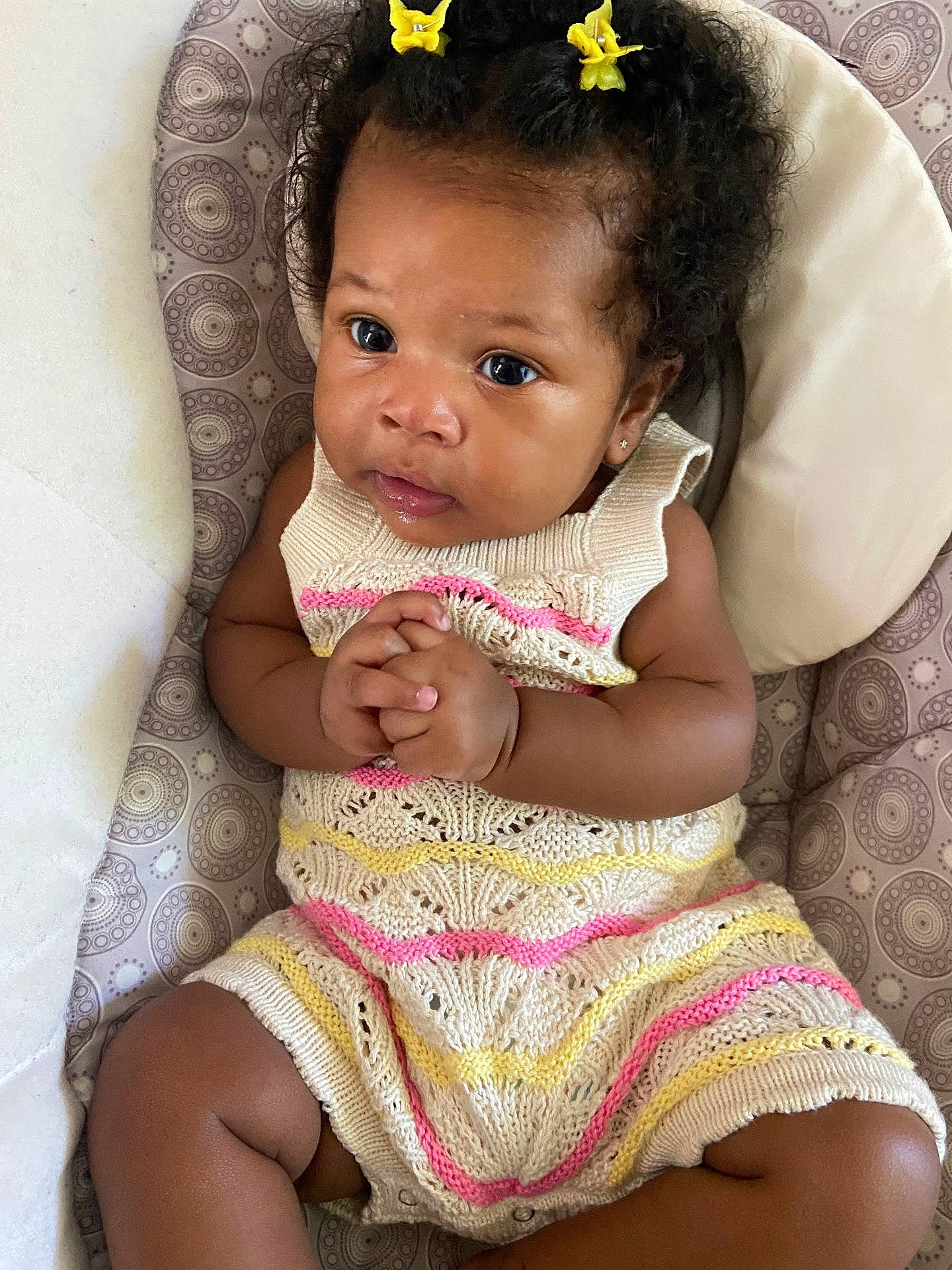 Dynver is registered to the contest to win money with this photo: accessories, baby, bodypart, bracelet, clothing, cushion, dress, face, finger, hair, hand, happy, head, homedecor, person, photography, portrait, sitting, sleeve, smile