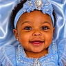 Maci joined the competition — help win amazing prizes! baby, child, smiling, portrait, blue_dress, headband, jewelry, curly_hair, closeup, happy, cute, infant, face, fashion, elegant, celebration, accessory, studio, background, adorable