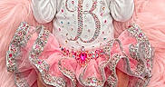 Maci is registered to the contest to win money with this photo: newborn, baby, sleeping, pink, dress, bow, headband, sparkles, gemstones, infant, soft_texture, cute, adorable, clothing, lying_down, portrait, child, feminine, fluffy, resting