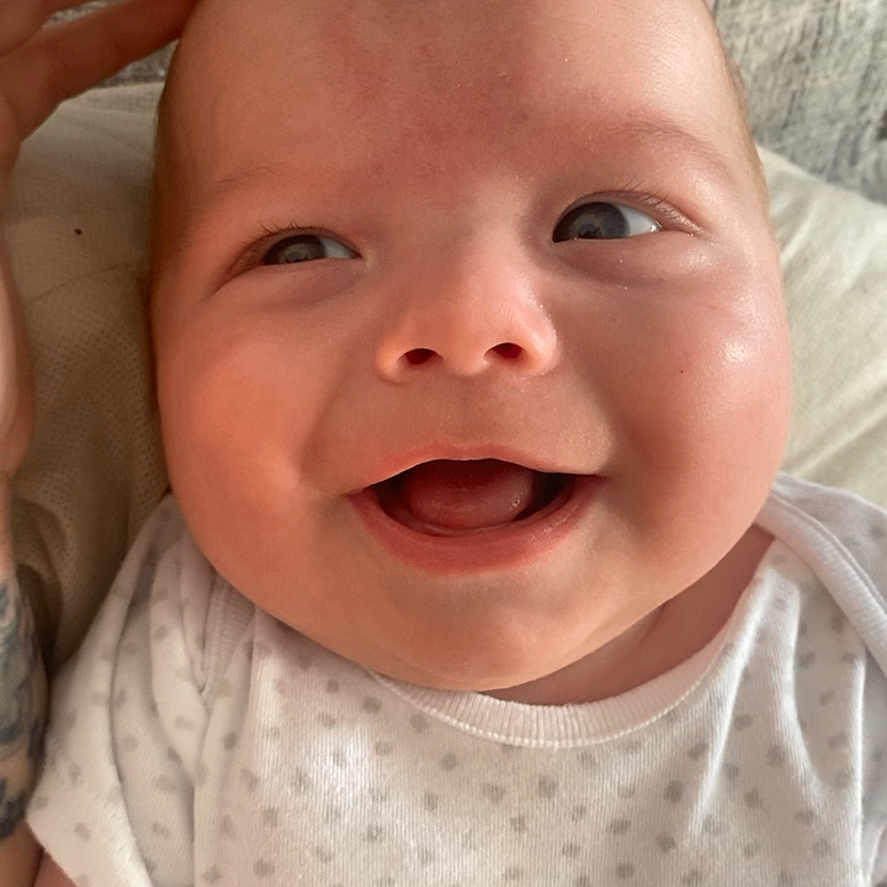 Jacob is registered to the contest to win money with this photo: baby, babylaughing, bodypart, face, finger, hand, happy, head, laughing, mouth, newborn, person, photography, portrait, smile, teeth