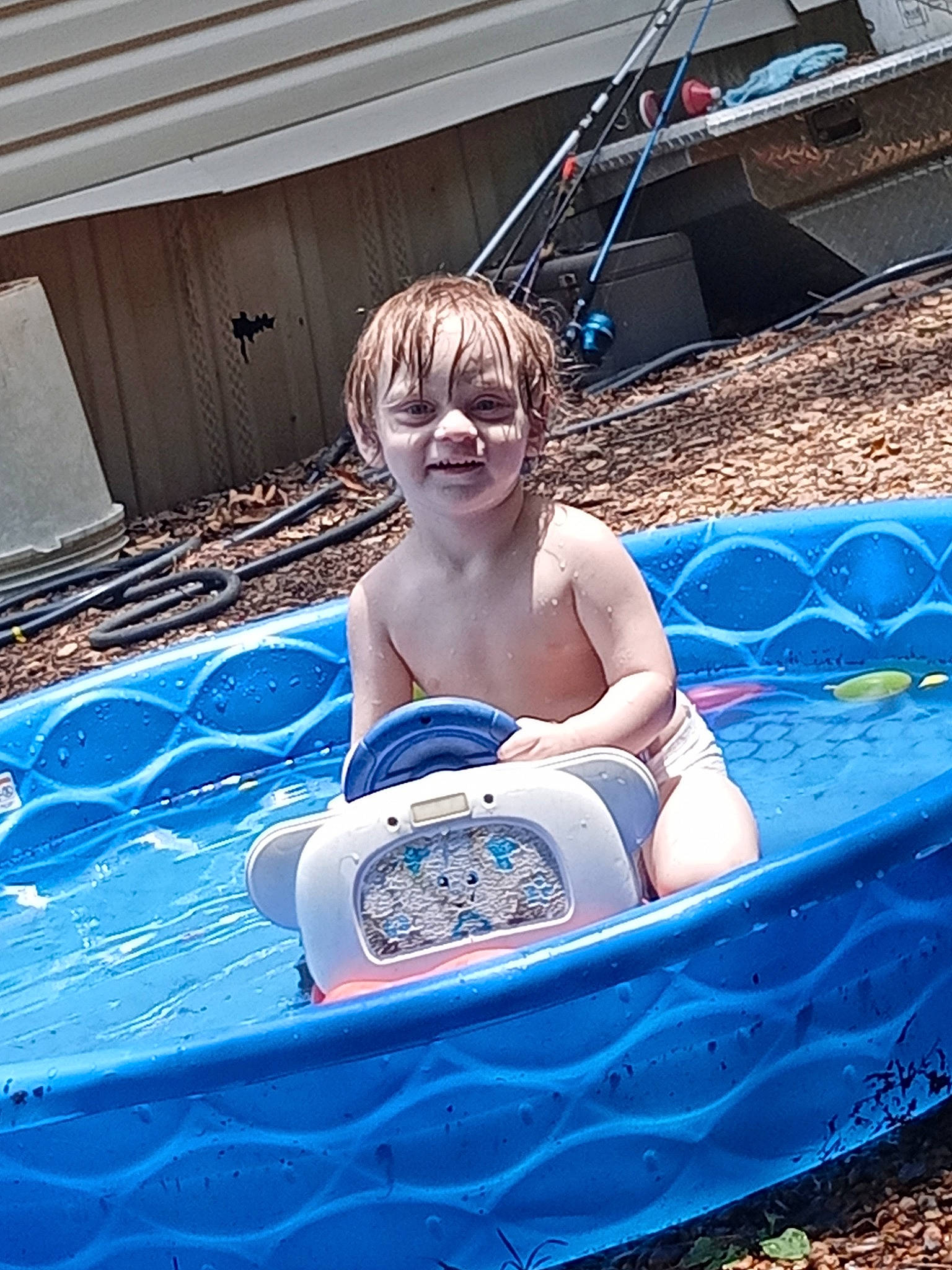 Jacob is registered to the contest to win money with this photo: azure, bathing, child, electric_blue, event, face, fun, grass, happy, inflatable, leisure, person, play, recreation, sitting, smile, sunlounger, swimming_pool, toddler, vacation