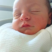 Nino participe au concours pour gagner de l'argent avec cette photo : newborn, baby, sleeping, blanket, white, knit, face, infant, soft, peaceful, closeup, hospital, child, portrait, human, skin, head, cute, resting, cozy
