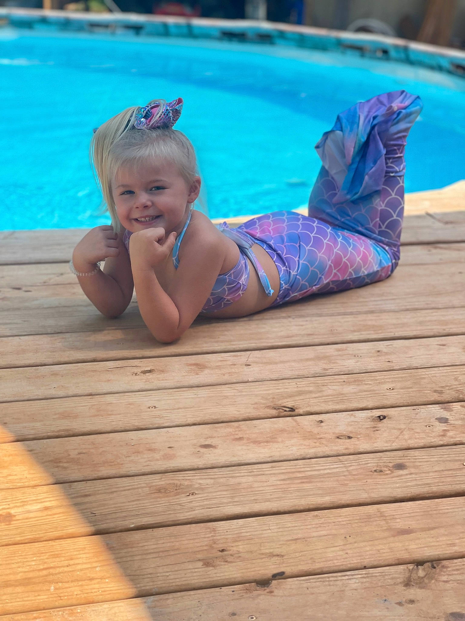 Kymberlin is registered to the contest to win money with this photo: azure, baby, barefoot, blue, floor, flooring, foot, fun, happy, hardwood, human_leg, joy, leisure, morning, person, recreation, swimming_pool, thigh, toddler, water