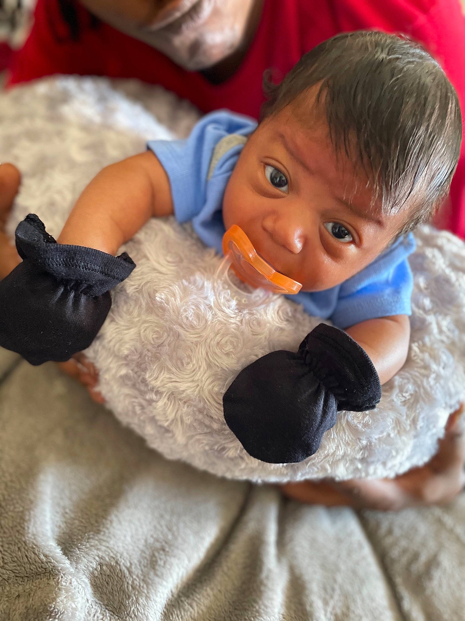Zakai is registered to the contest to win money with this photo: arm, baby_toddler_clothing, child, comfort, doll, finger, fur_clothing, gesture, hand, happy, linens, nose, person, plush, skin, stuffed_toy, textile, thumb, toddler, toy