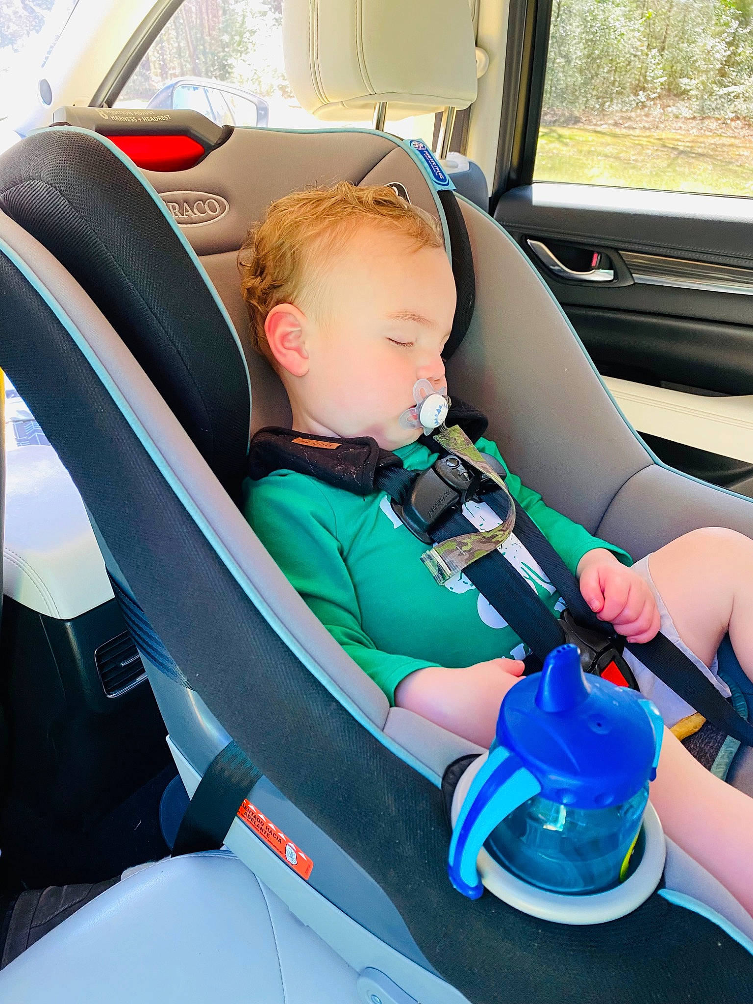 Kohen is registered to the contest to win money with this photo: auto_part, automotive_design, automotive_exterior, baby, baby_carriage, baby_products, car, car_seat, car_seat_cover, child, family_car, head_restraint, motor_vehicle, person, personal_luxury_car, seat_belt, steering_part, steering_wheel, toddler, vehicle