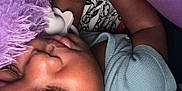 Jayson is registered to the contest to win money with this photo: baby, sleeping, plush_toy, purple, blanket, infant, child, peaceful, closeup, hand, soft_texture, cozy, eyelashes, skin, cute, resting, indoors, bed, comfort, nap