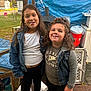 child, kids, lollipop, denim_jacket, denim_vest, grey_shirt, white_shirt, outdoor, backyard, smile, happy, grass, playground, swing, cooler, blue_tarp, friendship, casual_clothing, fun, portrait