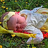 baby, sleeping, outdoor, flower, grass, headband, blanket, yellow, nature, peaceful, infant, child, greenery, cute, resting, soft, sunlight, portrait, newborn, clothing
