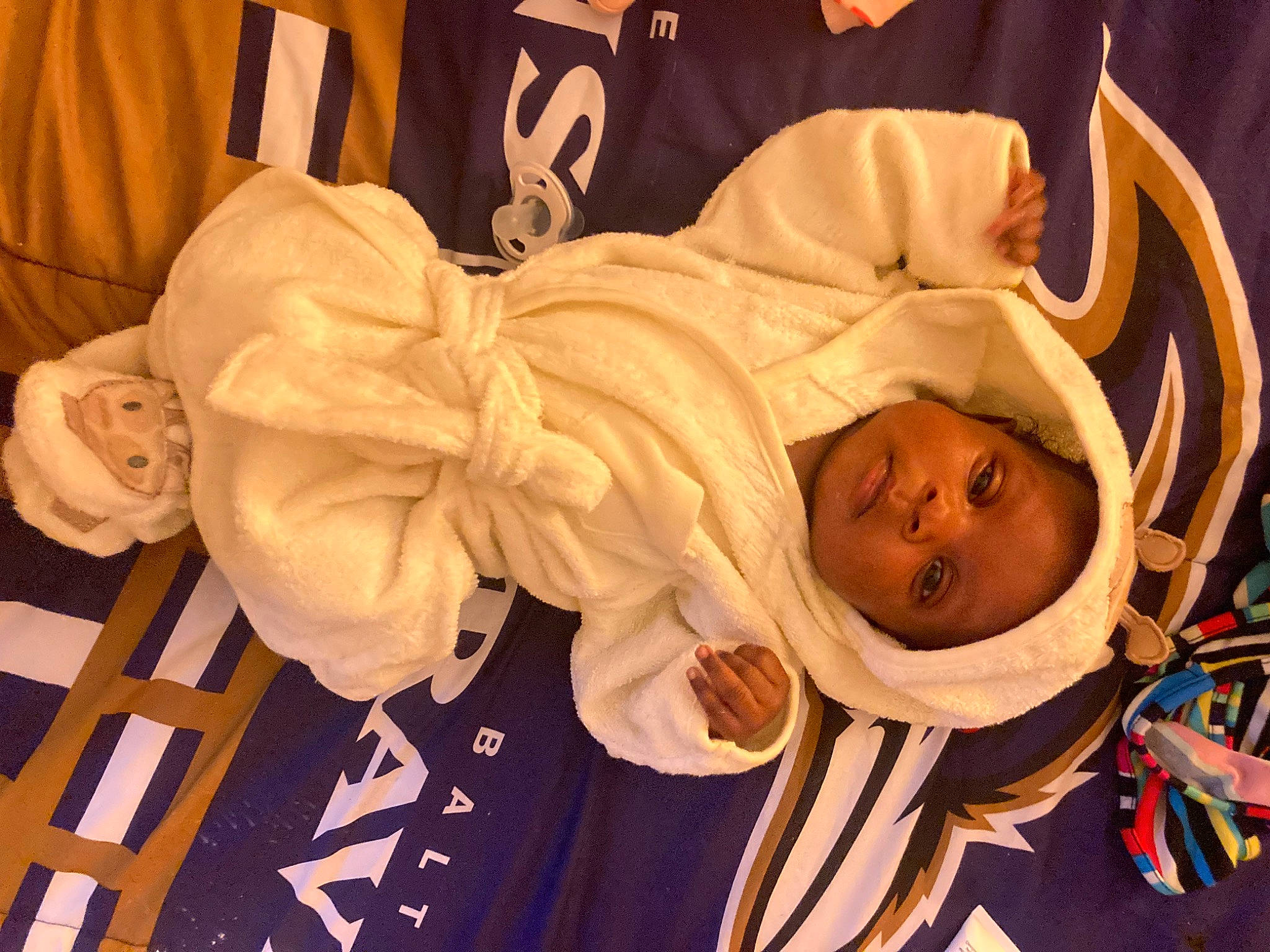 Ariyah is registered to the contest to win money with this photo: baby, child, comfort, contact_sport, event, happy, person, room, sleeve, toddler, wood