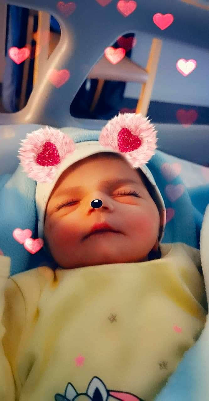 Tyana participe au concours pour gagner de l'argent avec cette photo : baby, baby_sleeping, baby_toddler_clothing, beauty, cap, cheek, child, comfort, eyelash, flower, fun, happy, lip, mouth, nose, peach, person, pink, skin, smile