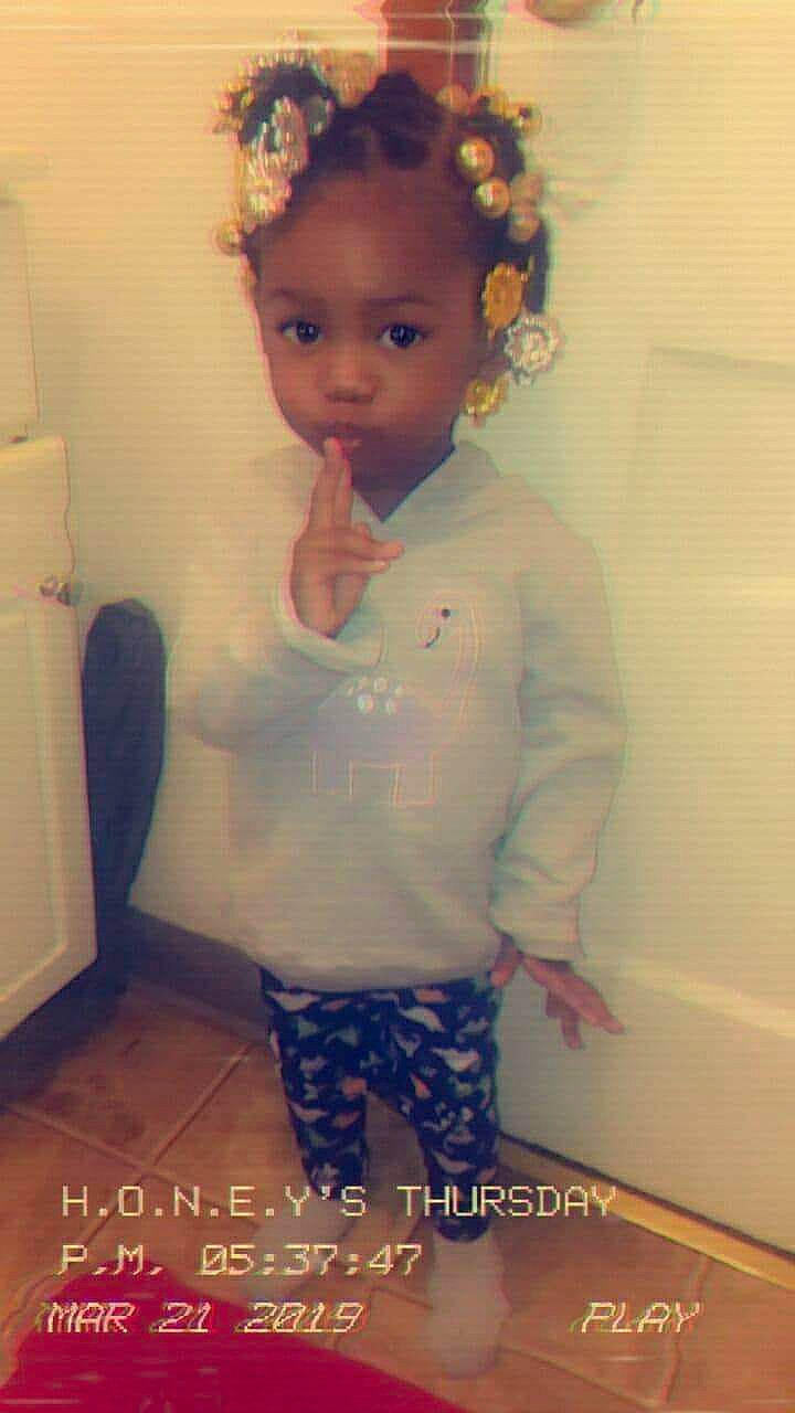 E'Monni is registered to the contest to win money with this photo: baby, cheek, child, ear, eye, eyebrow, face, forehead, hair, hair_accessory, hairstyle, head, iris, lip, long_hair, nose, person, skin, smile, standing