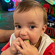 Skylar joined the competition — help win amazing prizes! toddler, child, face, hand, food, eating, vegetable, cucumber, curious, indoors, arcade, colorful, closeup, cute, baby, playful, casual, person, skin, hair