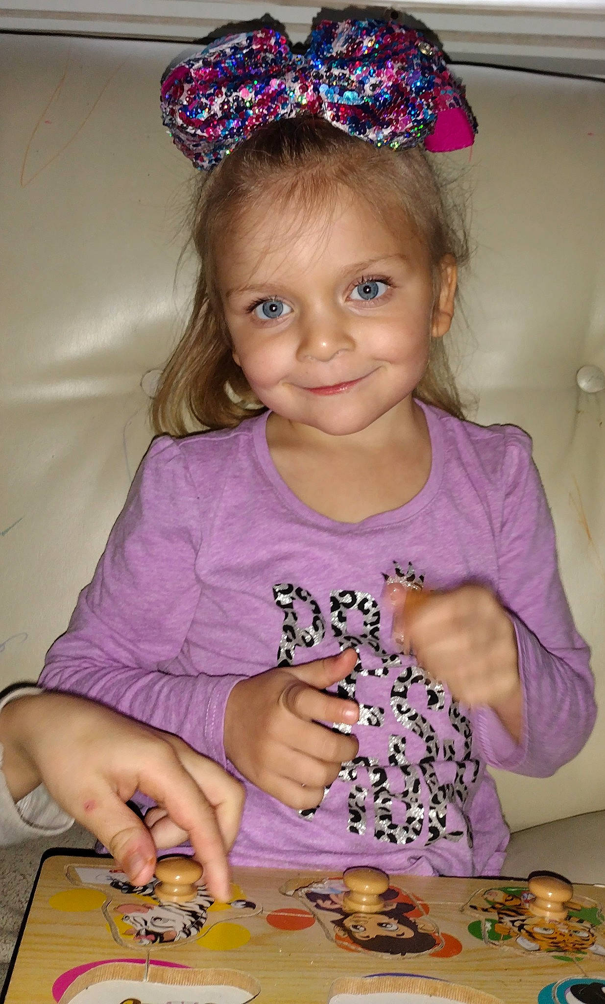 Abigail is registered to the contest to win money with this photo: baby_toddler_clothing, baking, birthday, child, clothing, dress, event, face, finger, fun, happy, headband, headpiece, joy, person, pink, purple, sweetness, t_shirt, toddler