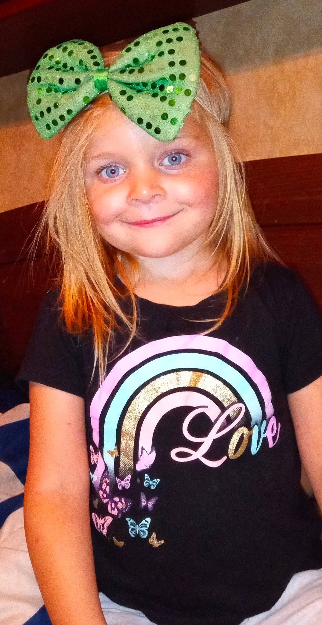 Abigail is registered to the contest to win money with this photo: blond, child, costume_hat, eyelash, fashion_accessory, fun, happy, hat, headpiece, headwear, joy, magenta, party_hat, party_supply, pattern, person, pink, sleeve, sleeveless_shirt, smile