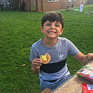 Tyson is registered to the contest to win money with this photo: backyard, child, day, fun, green, human_action, lawn, outdoor_play_equipment, play, playground