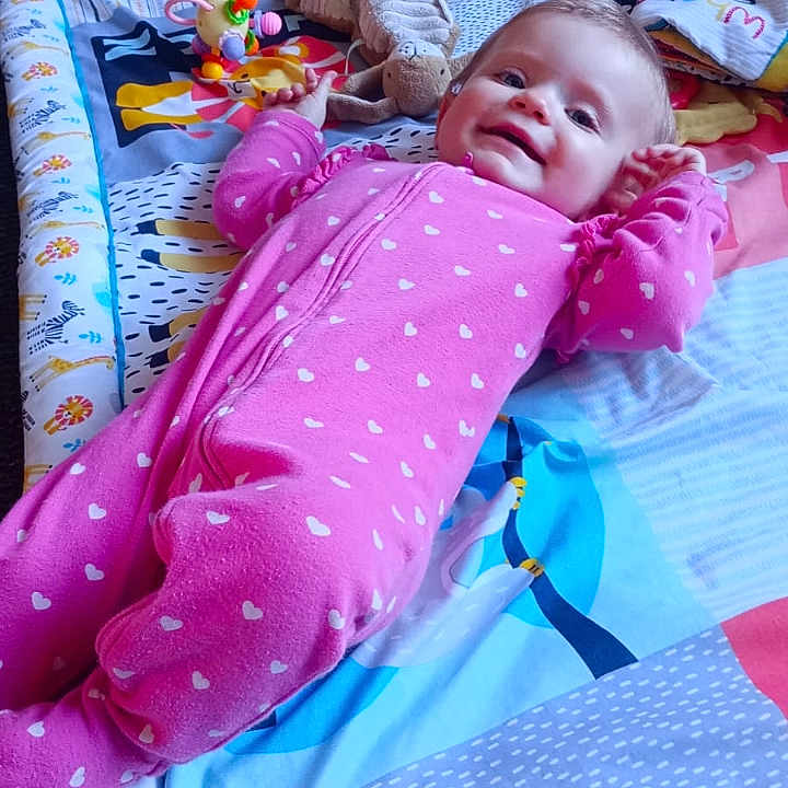 Violet joined the competition — help win amazing prizes! baby, bed, bedroom, blanket, clothing, cushion, face, furniture, happy, head, homedecor, indoors, laughing, pajamas, person, photography, portrait, quilt, smile, toy