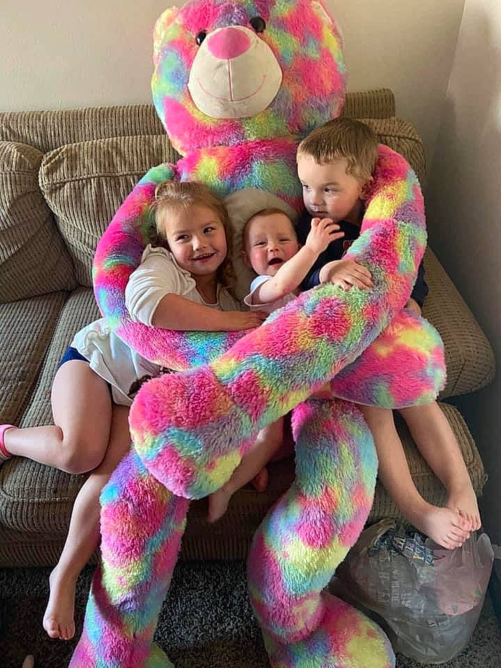 Caleb joined the competition — help win amazing prizes! baby_toddler_clothing, child, comfort, couch, foot, happy, hug, interaction, joy, lap, living_room, love, magenta, person, pink, plush, sock, stuffed_toy, thigh, toddler