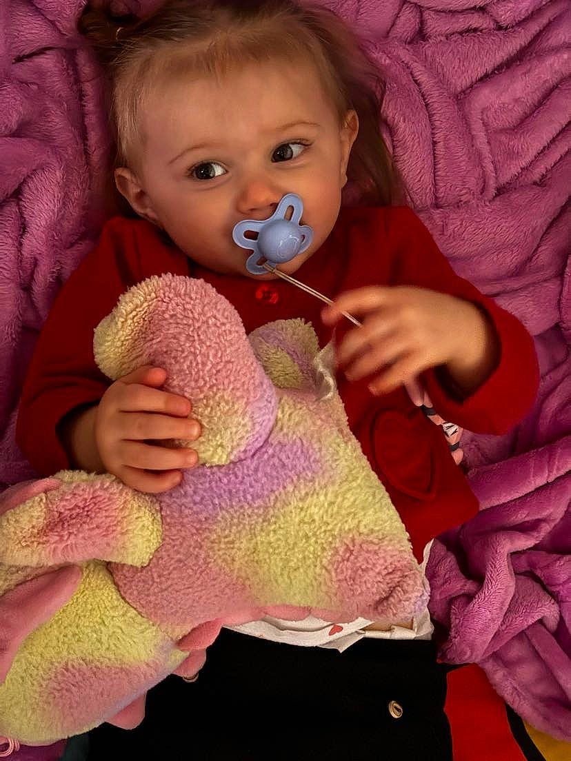 Ava a rejoint le concours — aidez-le/la à gagner de superbes lots ! baby, baby_toddler_clothing, cheek, doll, eye, eyelash, face, finger, hair, head, iris, lip, neck, person, pink, purple, skin, sleeve, textile, thumb