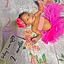baby, infant, smiling, pink_tutu, headband, flower, blanket, floral_pattern, milestone_blocks, months, cute, portrait, child, lying_down, happy, celebration, tulle_skirt, skin, person, small_child