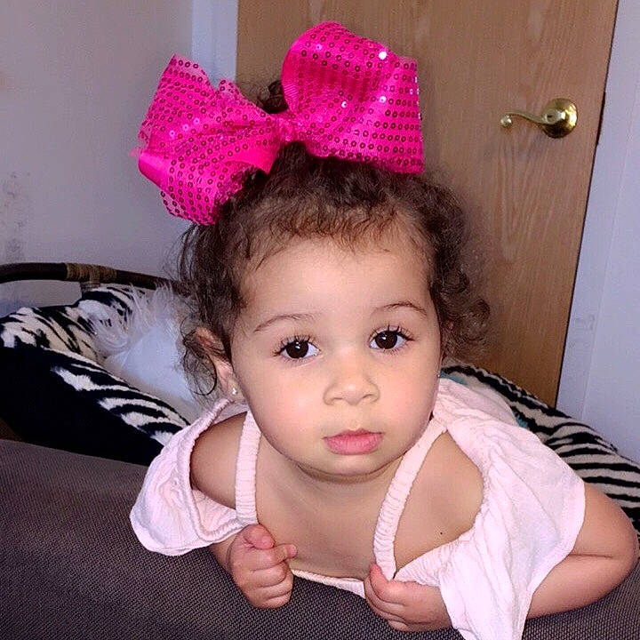 Miyah is registered to the contest to win money with this photo: baby, baby_toddler_clothing, child, clothing, costume_accessory, ear, fashion_accessory, hair_accessory, headband, headgear, headpiece, person, pink, toddler