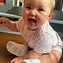 Darcie-Mae joined the competition — help win amazing prizes! baby, child, happy, smiling, sitting, indoor, wooden_surface, white_shoes, pink_clothing, cute, infant, portrait, face, cheerful, young_child, small_hands, short_hair, expression, casual, bright