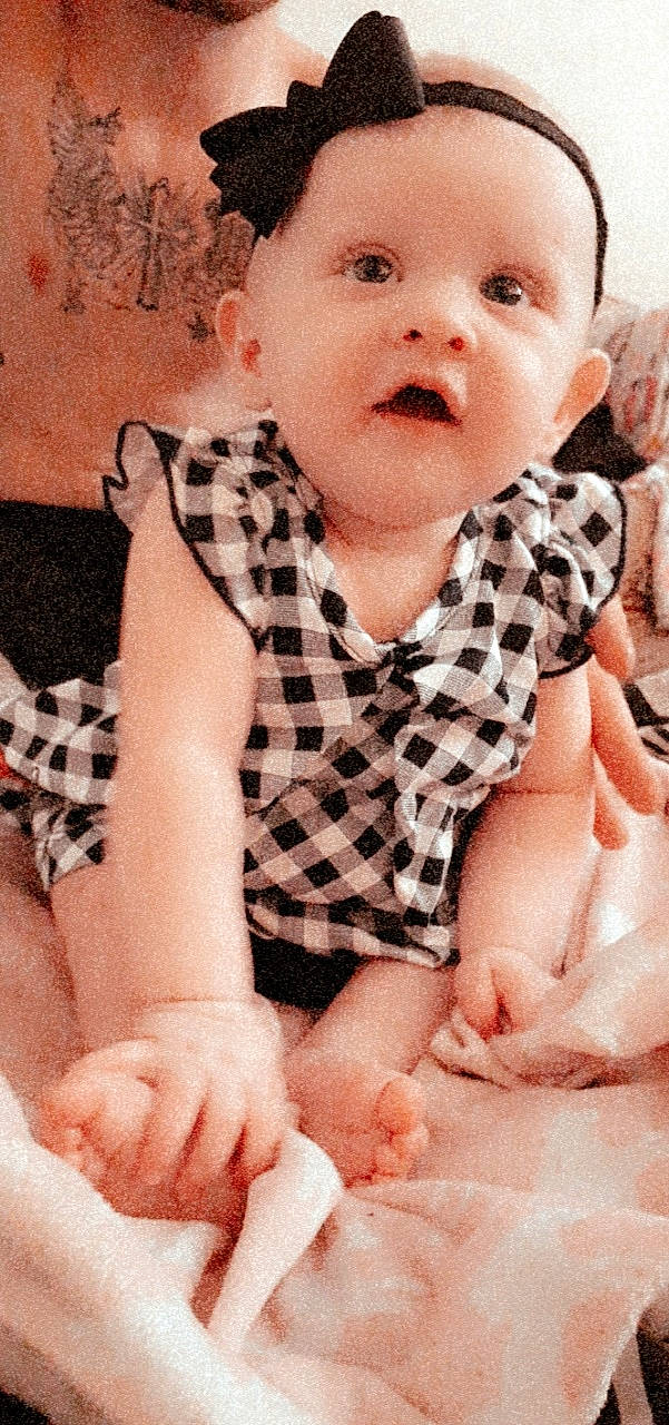 Kynzlee is registered to the contest to win money with this photo: baby, baby_toddler_clothing, cheek, child, face, finger, hand, nose, person, sitting, skin, thumb, toddler