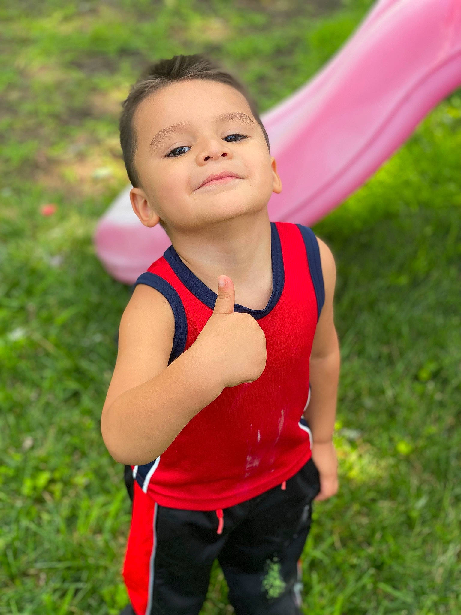 Emiliano joined the competition — help win amazing prizes! baby_toddler_clothing, child, face, finger, flash_photography, fun, gesture, grass, grassland, happy, human_body, joy, leisure, people_in_nature, person, pink, plant, recreation, running, shoulder