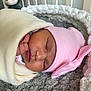 baby, baby_bedding, blanket, bow, child, closeup, cozy, cute, face, indoors, infant, newborn, newborn_baby, pink_hat, portrait, resting, sleeping, soft, warm, wrapped