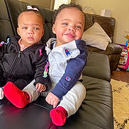 Raylen is registered to the contest to win money with this photo: architecture, baby, building, clothing, coat, couch, cushion, face, furniture, head, homedecor, hosiery, indoors, jacket, livingroom, person, photography, portrait, room, sock