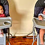baby, chair, clothing, crib, cutlery, eating, face, food, furniture, happy, head, highchair, hosiery, infantbed, person, sock, spoon