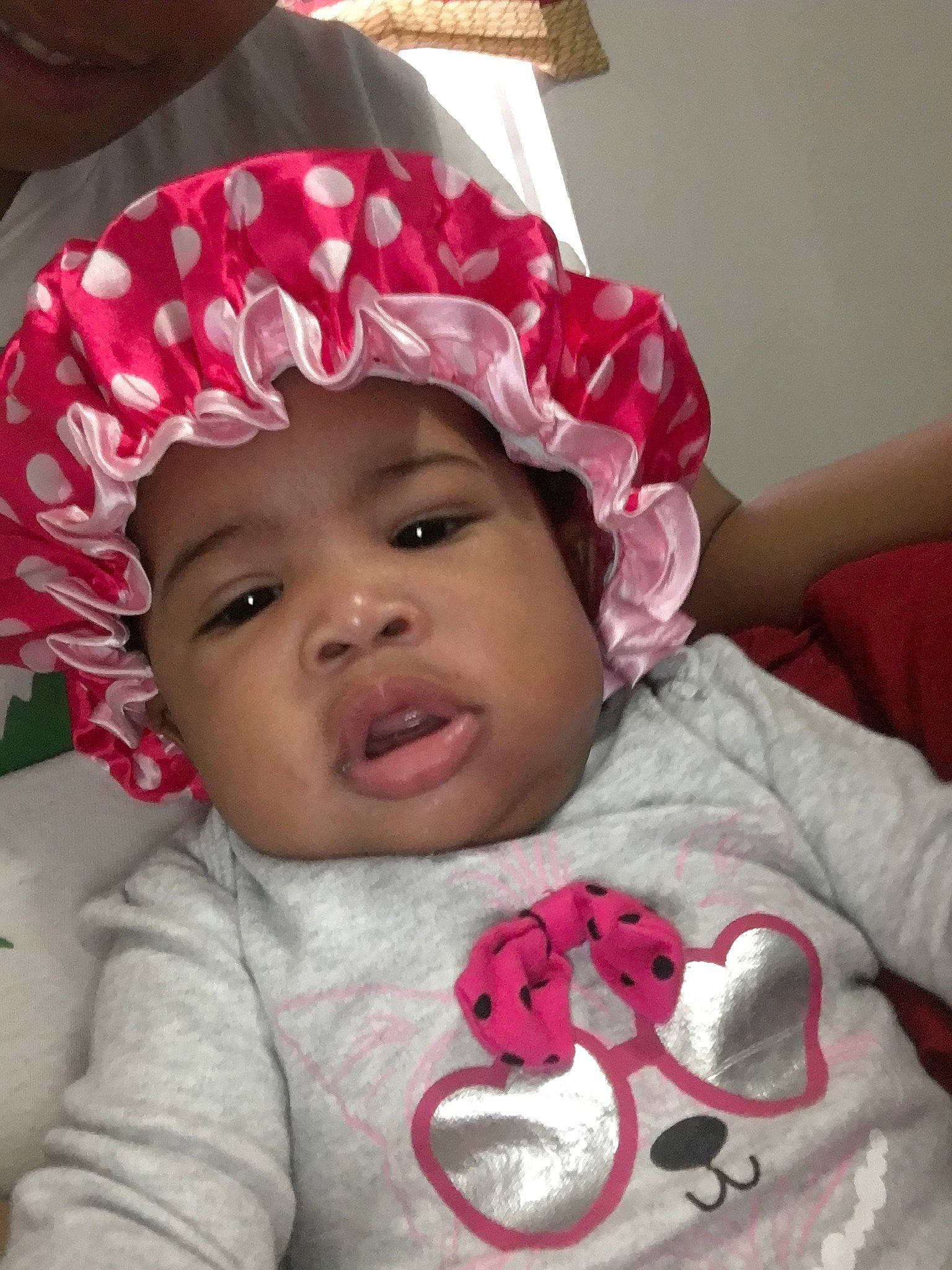 Malaysia is registered to the contest to win money with this photo: baby, baby_products, baby_toddler_clothing, bonnet, cheek, child, hair_accessory, headgear, headwear, person, pink, smile, toddler